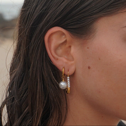 Woman with wet hair standing on a beach